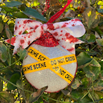 crime scene ornament on tree