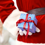 gift behind Santa's back