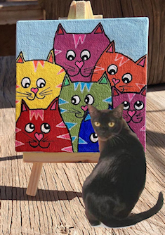 cat in front of cat painting