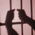 hands on prison bars