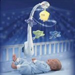 baby in crib with mobile
