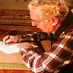 old man writing letters