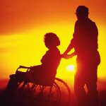 man with woman in wheelchair