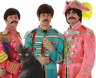 black cat with Paul, George and Ringo impersonators