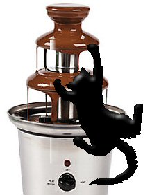 cat climbing up chocolate fountain