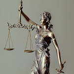 statue holding scales of justice