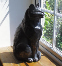 cat statue in window